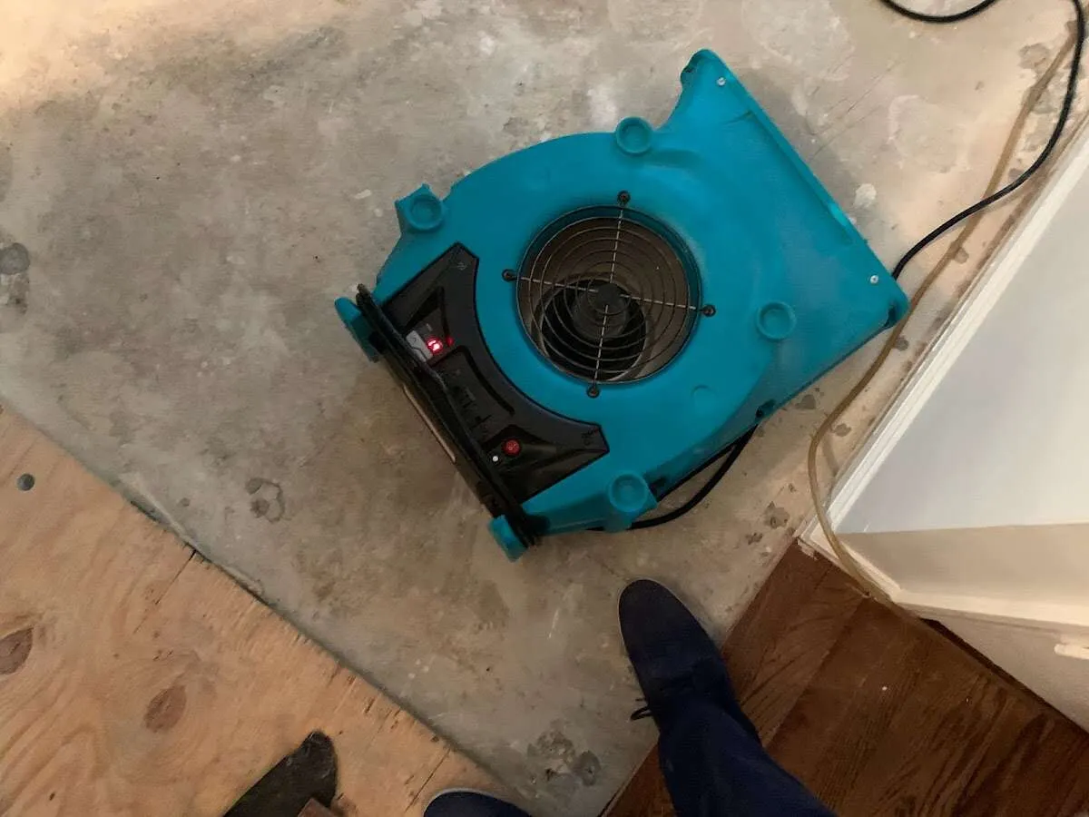 Air mover drying subfloor during Leak Detection & Repair in Hunters Creek
